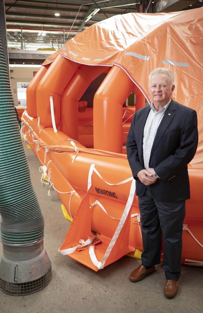 Liferaft Systems Australia Managing Director Mike Grainger with a 100 person self righting inflatable liferaft at Derwent Park. Picture: Chris Kidd