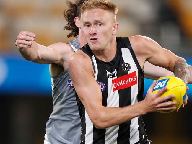 BRISBANE, AUSTRALIA - SEPTEMBER 21: Jaidyn Stephenson of the Magpies is tackled by Darcy Byrne-Jones of the Power during the 2020 AFL Round 18 match between the Collingwood Magpies and the Port Adelaide Power at The Gabba on September 21, 2020 in Brisbane, Australia. (Photo by Michael Willson/AFL Photos via Getty Images)