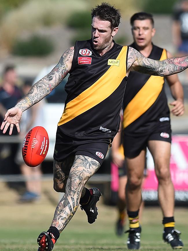 Dane Swan gets a kick away for Westmeadows. Picture: Lawrence Pinder