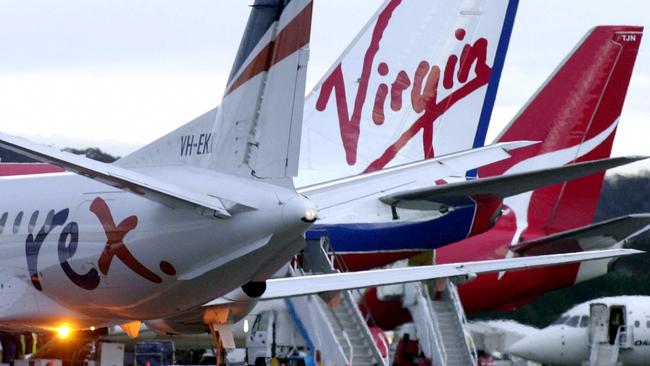 24/07/2003 PIRATE: 08/07/2003. (L-R) Regional Express (REX), Virgin Blue and Qantas planes at Canberra airport. Aviation / Aircraft / Plane / Exterior