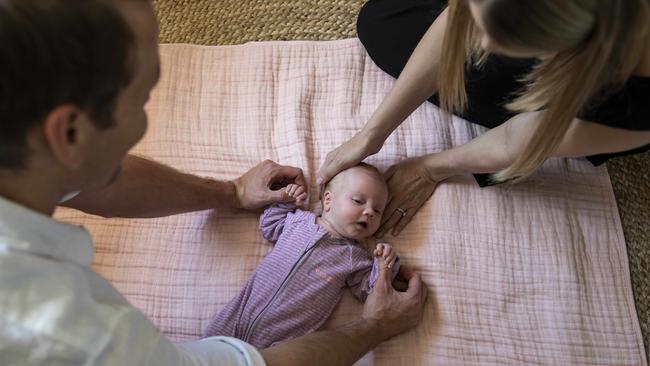 Sarah and Tim with their baby daughter Charlotte. Picture: Mark Cranitch