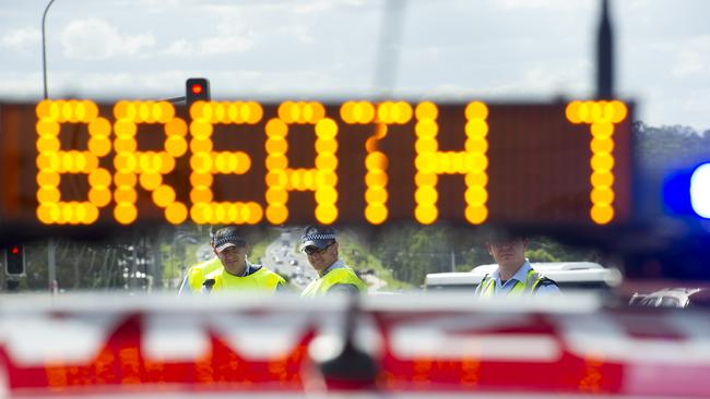 Police conducting a roadside breath test operation.