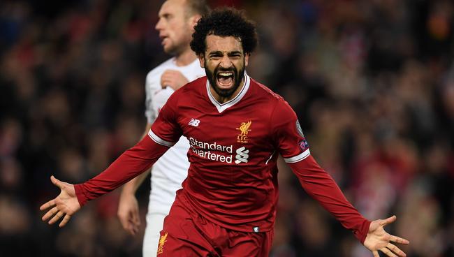 (FILES) This file photo taken on December 6, 2017 shows Liverpool's Egyptian midfielder Mohamed Salah celebrating scoring their seventh goal during the UEFA Champions League Group E football match between Liverpool and Spartak Moscow at Anfield in Liverpool, north-west England.  Prolific goalscorers Mohamed Salah of Egypt was named on December 18, 2017 among the three finalists for the African Player of the Year award.  / AFP PHOTO / Paul ELLIS