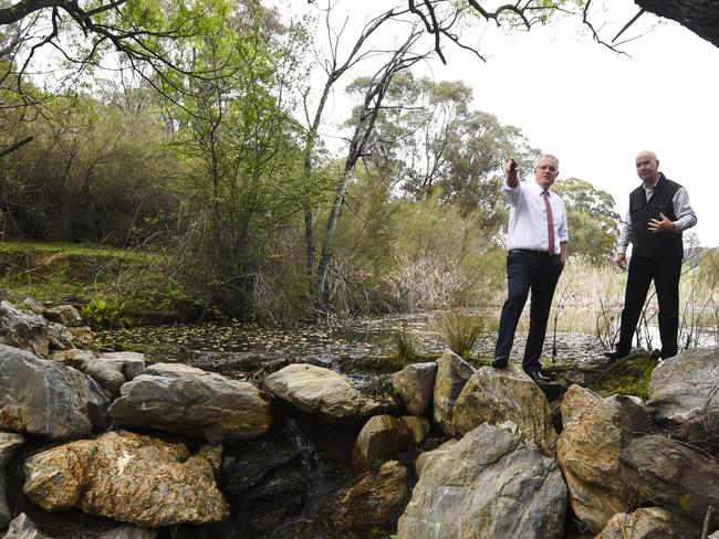 Prime Minister Scott Morrison with Gary Nairn as they look at a creek during a visit to Mulloon Creek Natural Farm near Bungendore. Picture: AAP