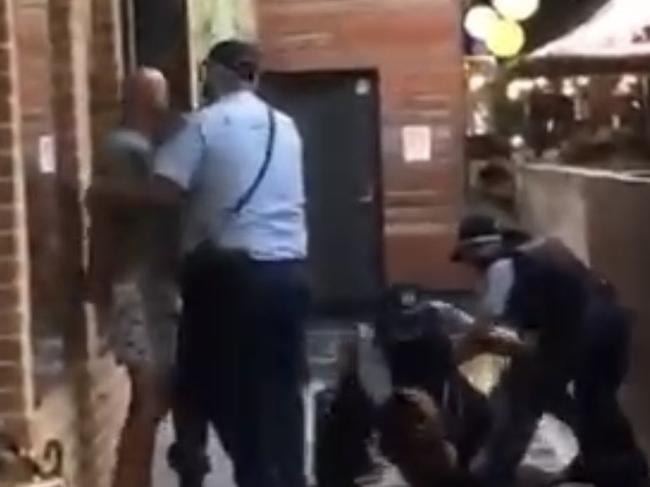 Two men arrested at Stocklands Wetherill Park, accused of assaulting female police officers after being asked to wear a mask. Pepper spray was used in the wrestle to detain them. Picture: 9 News via NCA NewsWire