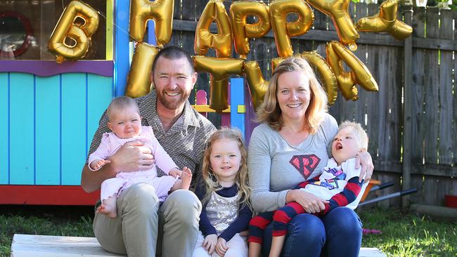 Ina and Dave Mills celebrate Roki’s third birthday in July with his sisters, Ruby, 4, and seven-month-old Rosie. Picture: Troy Snook