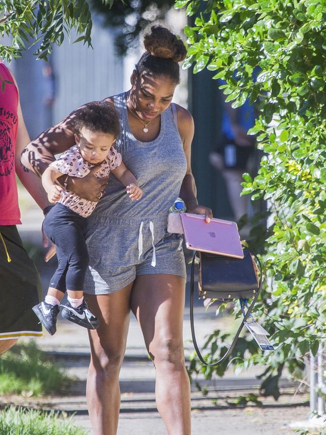 Serena Williams and her husband Alexis Ohanian enjoy an afternoon walk with their 1-year-old daughter Alexia Olympia. Serena's daughter looked seriously cute, toddling her way down the footpath, wearing Nike sneakers like her Mummy. Picture: MediaMode