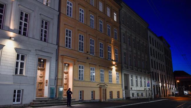 A police officer stands guard outside the Berlin house where Angela Merkel is to self isolate. Picture: AFP.