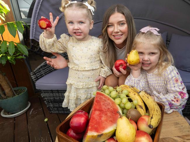 Mum Meg Marriott with daughters Maisie, 2, and Meika, 4, says she supports a ban on cartoon characters on foods. Picture: Tony Gough