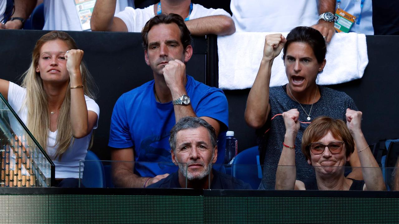 Women’s tennis great Amelie Mauresmo (second row, right) has coached Lucas Pouille into the Australian Open semi-finals. (Photo by DAVID GRAY / AFP)