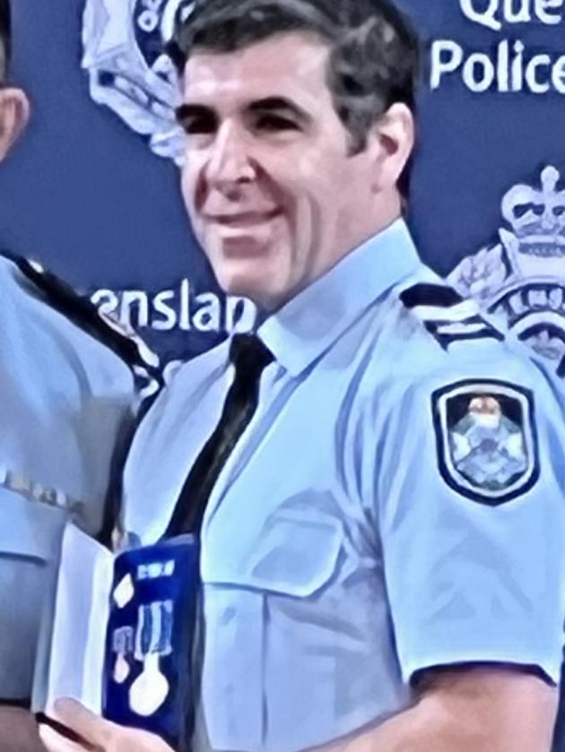 Senior Constable Paul Roberts with Assistant Commissioner Brian Connors.