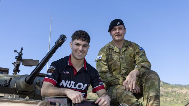 Supercar driver James Golding on board a 2nd Cavalry Regiment tank at Lavarack Barracks in Townsville ahead of the NTI Townsville 500. Picture: Mark Horsburgh / Supercars Media