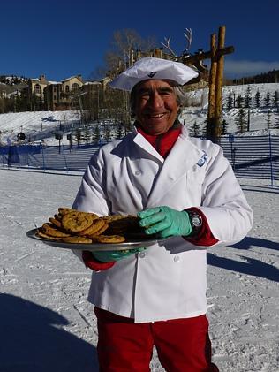 A man handing at chocolate chip cookies at the ski base in Beaver Creek, Colorado, USA