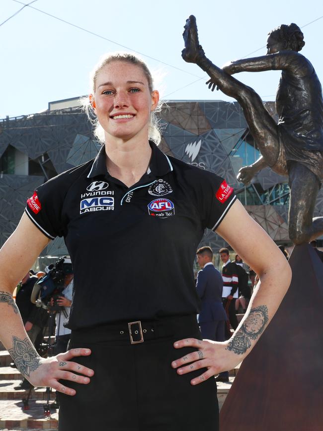 Tayla Harris in front of the statue in Federation Square Picture: AAP Image/David Crosling.