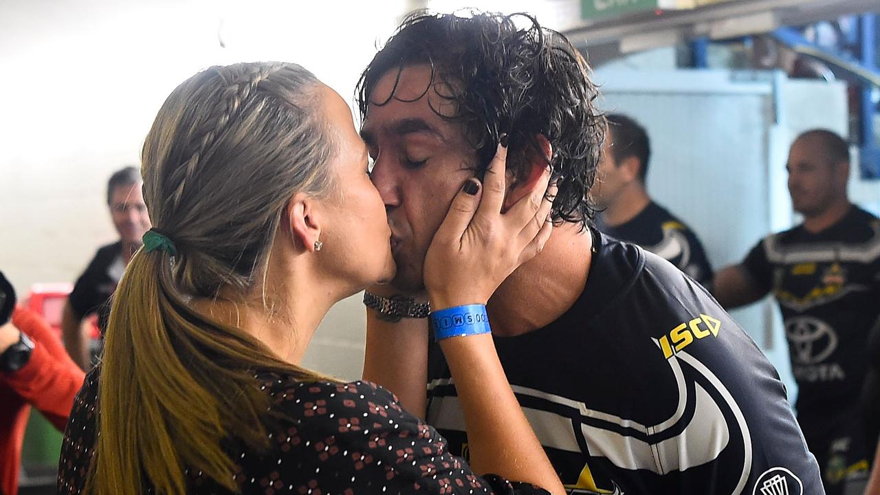 Johnathan Thurston of the Cowboys kisses his wife Samantha after playing his last home NRL match in Townsville.