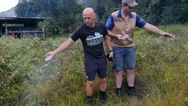 Mick O’Malley (left) and David Howell spread the ashes of Kokoda veteran George Cops on the track early in 2022. Picture: Supplied