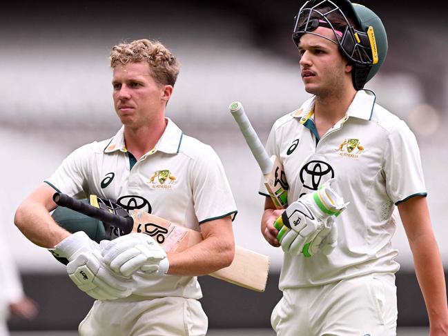 Australian batsmen Nathan McSweeney (L) and Sam Konstas (R) walk off at tea on the third day of the Australia A against India A cricket match at the Melbourne Cricket Ground (MCG) in Melbourne on November 9, 2024. (Photo by William WEST / AFP) / --IMAGE RESTRICTED TO EDITORIAL USE - STRICTLY NO COMMERCIAL USE--