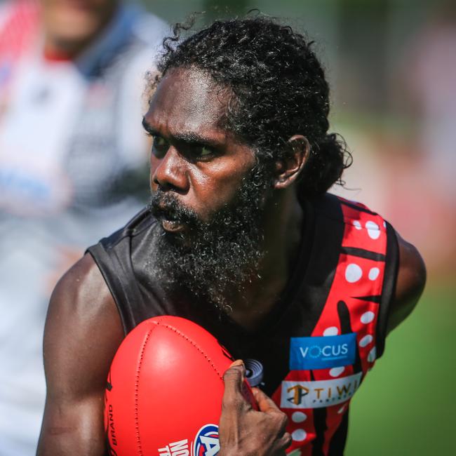 The Tiwi Bombers’ Jason Puruntatameri is known for his run and carry, among plenty of other strengths on the field. Picture: Glenn Campbell