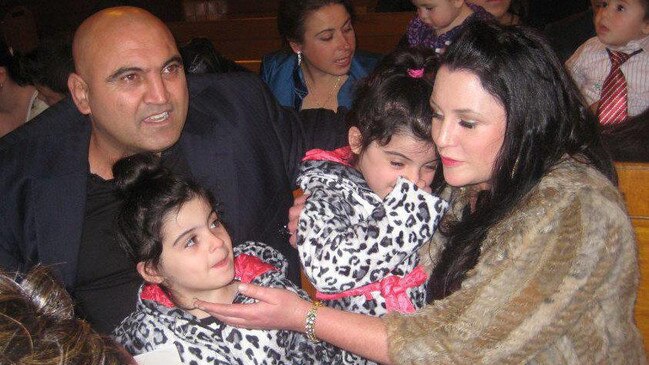 Joe Antoun, 50, with his wife Teagen who says she and their twin daughters are still traumatised by his death eight years ago.