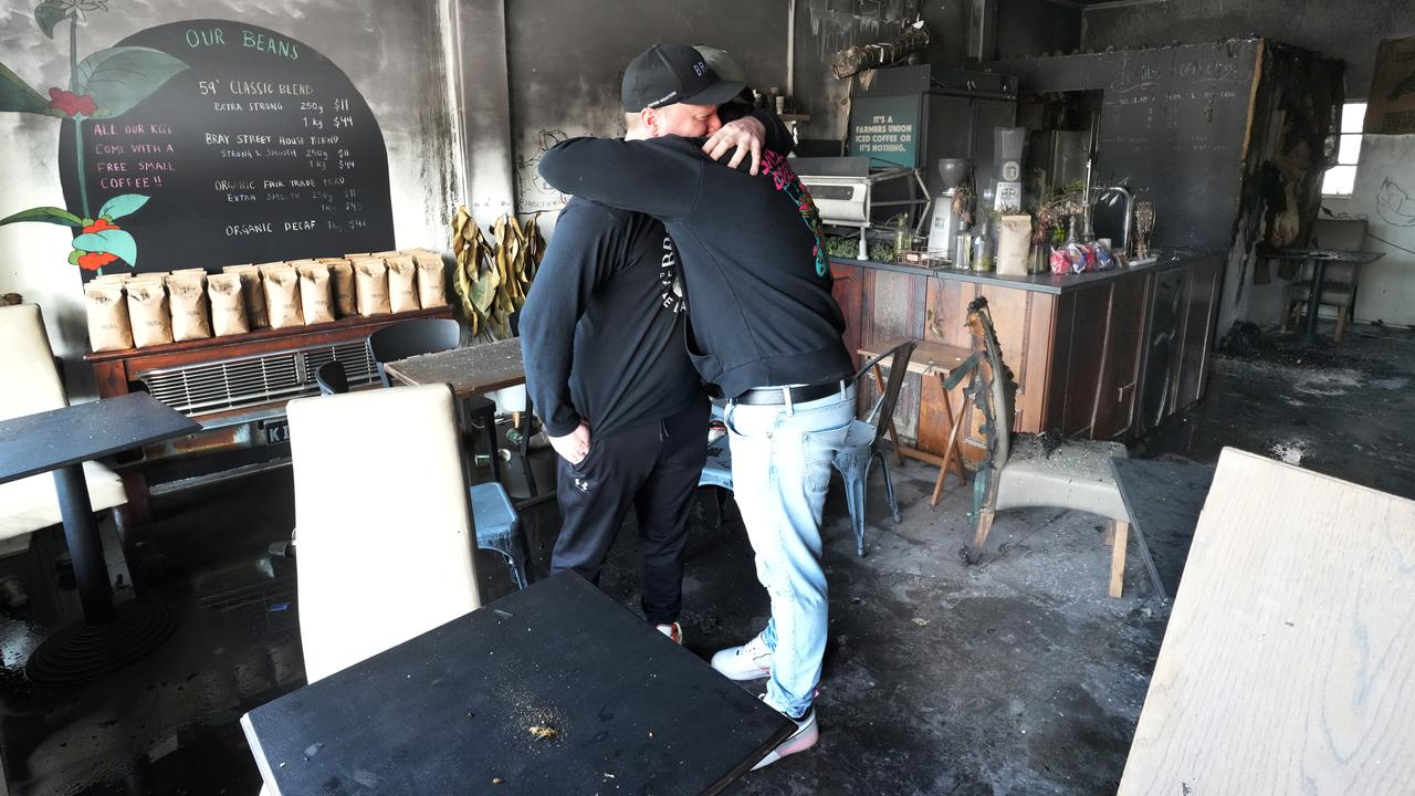 Mr Horrell is comforted by his brother Nick, who had come down from Queensland to celebrate the 8th anniversary of the business on Saturday. Picture: Dean Martin