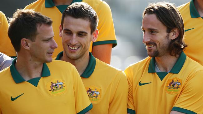 Alex Wilkinson, Matthew Spiranovic and Josh Kennedy line up for the team photo.