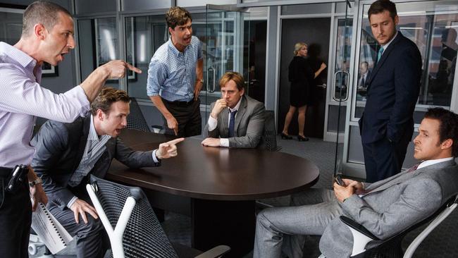 Jeremy Strong, from left, Rafe Spall, Hamish Linklater, Steve Carell, Jeffry Griffin and Ryan Gosling in e <i>The Big Short</i>.