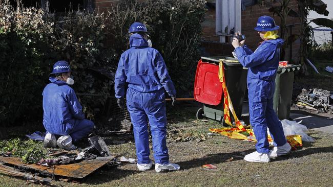 Specialists spent Wednesday photographing and documenting the remains which were pulled from the home. Picture: Richard Dobson