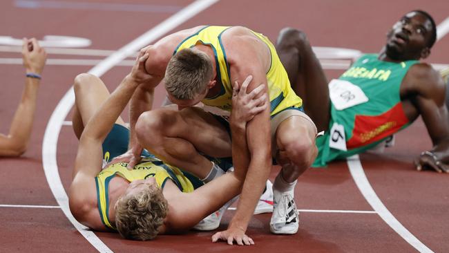 Ashley Moloney (ground) and Cedric Dubler share a special moment at the Tokyo Olympics. Picture: Alex Coppel