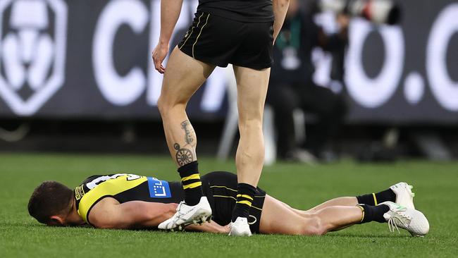 MELBOURNE. 25/06/2022.. AFL Round 15 . Geelong vs Richmond at the MCG. Richmonds Dion Prestia lies unconscious after collision with Tom Stewart during the 1st qtr. . Photo by Michael Klein