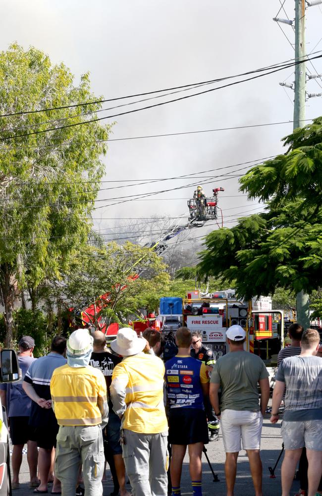 Neighbours watched on as fire crews got the blazes under control. Picture: Steve Pohlner