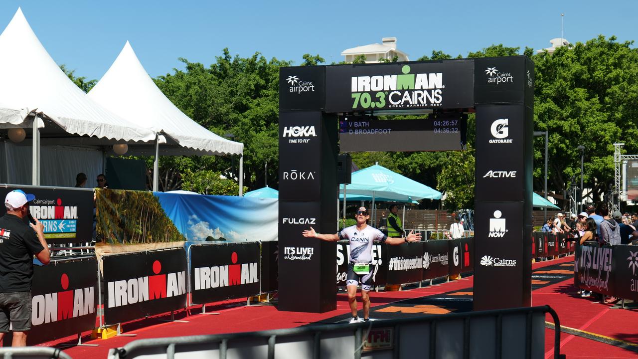 Cairns Ironman 70.3 competitor Dan Broadfoot crossing the finish line. Photo: Georgia Clelland.