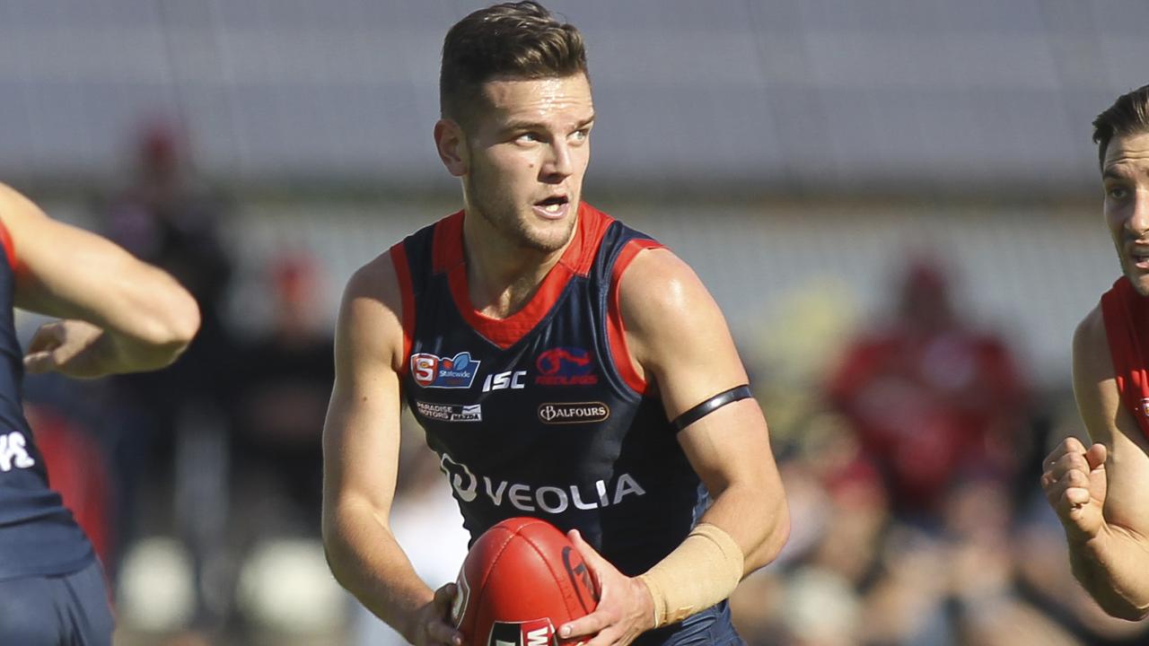 SANFL: North Adelaide v Norwood at Prospect Oval. Norwood's Matthew Nunn evades North's Aidan Tropiano. 25 April 2019. Picture Dean Martin