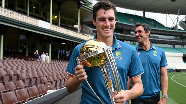 Cummins with the World Cup trophy. Picture: Saeed Khan / AFP