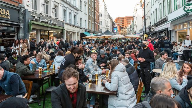 Crowds of people dine and drink outdoors in Soho, London. Picture: Getty Images