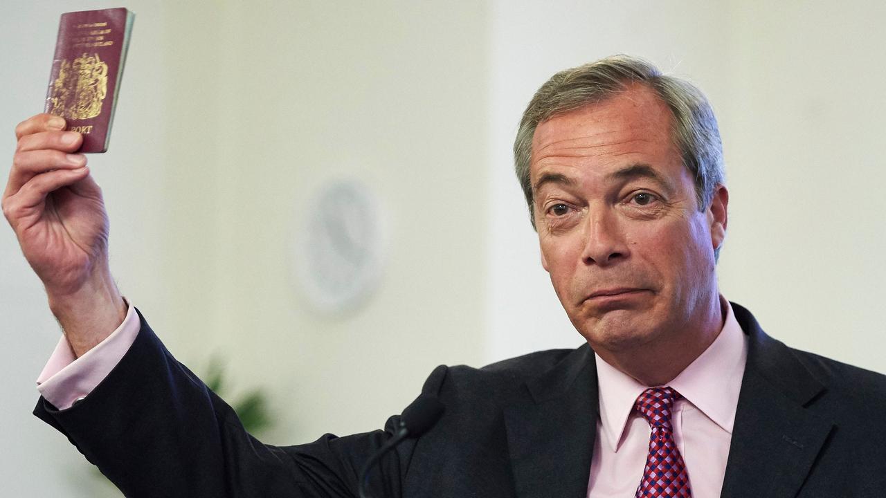 UK Independence Party leader Nigel Farage brandishes a burgundy UK passport while delivering an anti-European Union speech in 2016. Picture: AFP/Niklas Halle'n