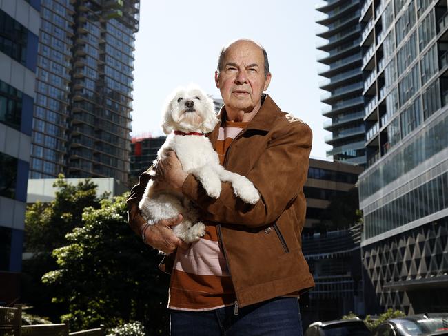 WEEKEND TELEGRAPHS SPECIAL. MUST TALK WITH PIC ED JEFF DARMANIN BEFORE PUBLISHING - Pictured in St Leonards is Retiree Paul Christopher with dog Macy, whose apartment will be plunged into shade all year round as a result of two new commercial buildings proposed for near him. Picture: Tim Hunter.