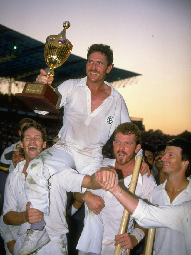 Dean Jones (L), Craig McDermott and Steve Waugh (far R) hold up captain Allan Border after winning the 1987 World Cup.