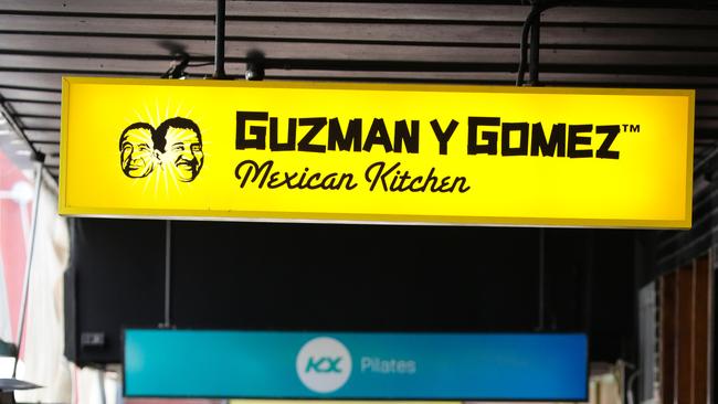 SYDNEY, AUSTRALIA - Newswire Photos JULY 26, 2021: A menulog delivery rider is seen picking up an order at the Mexican Food Chain Guzman Y Gomez during the COVID-19 lockdown in Sydney. Picture: NCA Newswire /Gaye Gerard