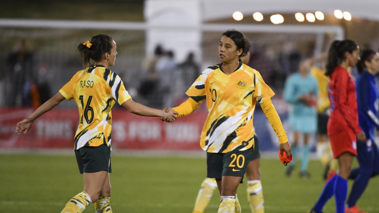 Hayley Raso #16 of Australia and Sam Kerr #20 high five after playing the United States