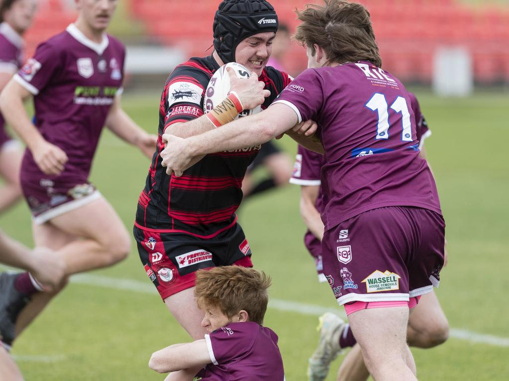 Matthew Williams of Valleys is tackled by Nate Fermor and Joseph Gillett (right) of Dalby. Picture: Kevin Farmer.