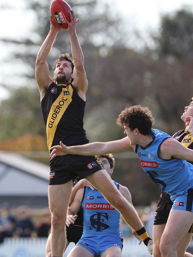 Glenelg captain Max Proud marks strongly in his side’s 105-point thrashing of Sturt on Monday. Picture: SANFL Image/David Mariuz