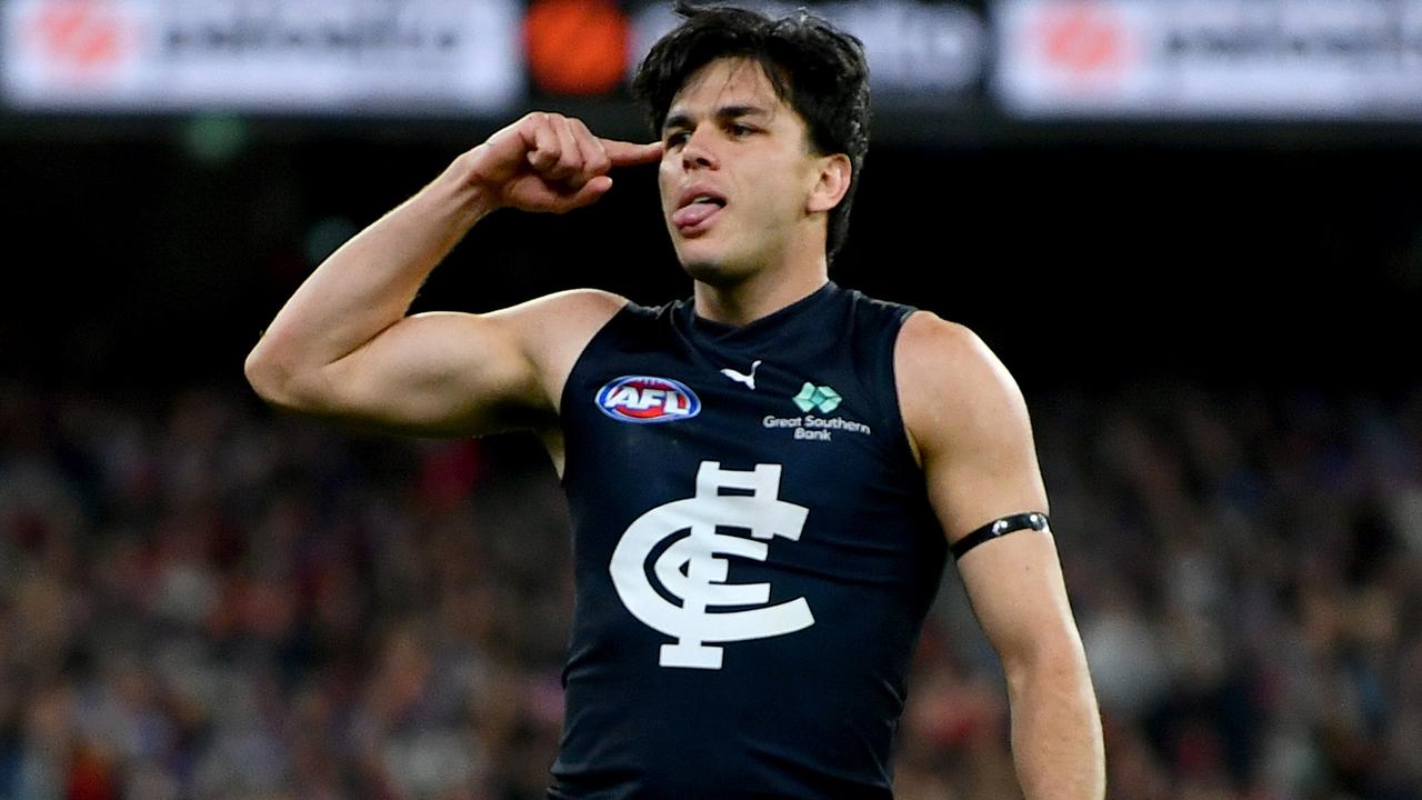 MELBOURNE, AUSTRALIA - JUNE 09: Elijah Hollands of the Blues celebrates kicking a goal during the round 13 AFL match between Essendon Bombers and Carlton Blues at Melbourne Cricket Ground, on June 09, 2024, in Melbourne, Australia. (Photo by Josh Chadwick/Getty Images)