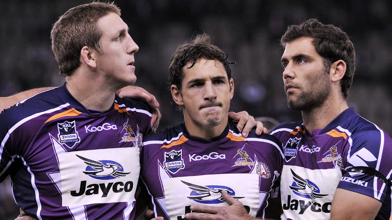 Melbourne Storm captain Cameron Smith (right) with former teammates Ryan Hoffman and Billy Slater after the club was caught cheating the cap in 2010.