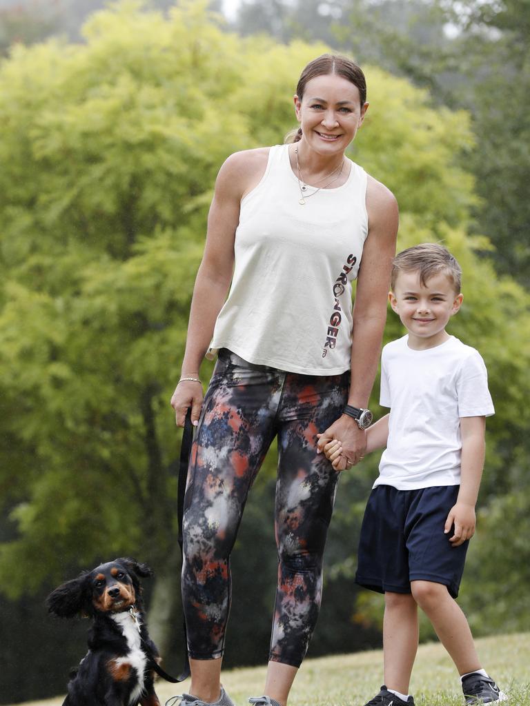 Michelle Bridges out for a walk with son Axel and their dog Banjo at home in the Southern Highlands. Picture: Jonathan Ng