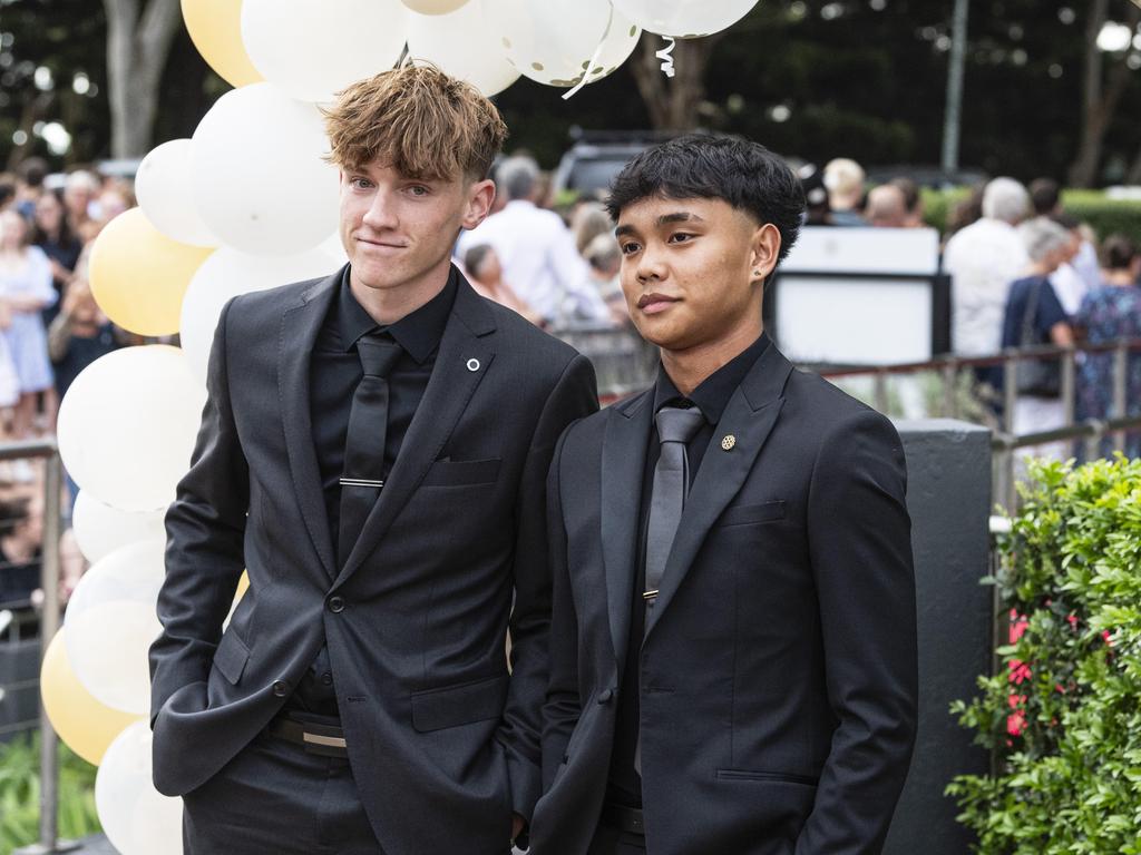 Sam Rametta (left) and Nico Cayanga at Centenary Heights State High School formal at Picnic Point, Friday, November 15, 2024. Picture: Kevin Farmer