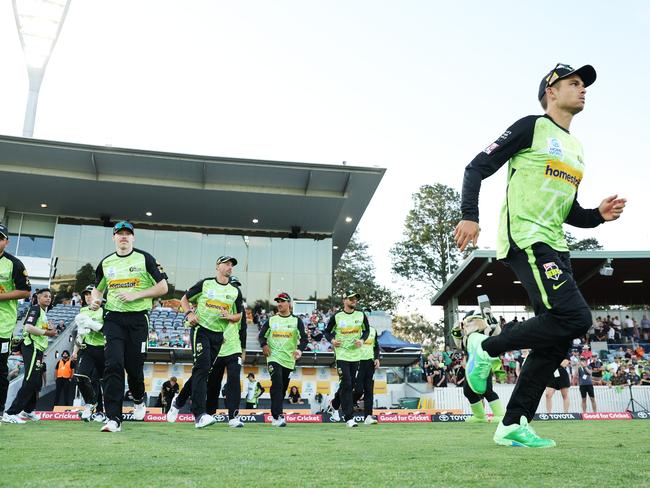 CANBERRA, AUSTRALIA - DECEMBER 12:  Chris Green of the Thunder leads the Thunder onto the field during the BBL match between Sydney Thunder and Brisbane Heat at Manuka Oval, on December 12, 2023, in Canberra, Australia. (Photo by Matt King/Getty Images)