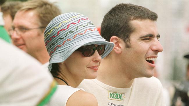 Actress Ashley Judd with boyfriend driver Dario Franchitti in the pit lane area at the Gold Coast Indy in October 2000. Picture: Nathan Richter.