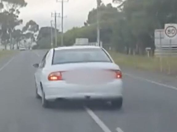 The white Holden Commodore was allegedly seen driving in an erratic manner. Picture: Channel 9