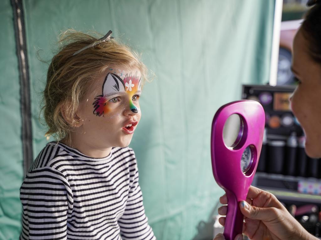 Gemma Petith, 6, getting her face painted by Calen District State College parent Kassandra Schaefer at the Calen Country Fair, Saturday, May 29, 2021. Picture: Heidi Petith