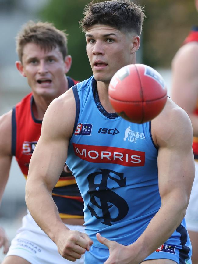 Sturt’s Tom Lewis fires out a handpass in front of Adelaide’s Matt Crouch in Round 6. Picture: David Mariuz/SANFL